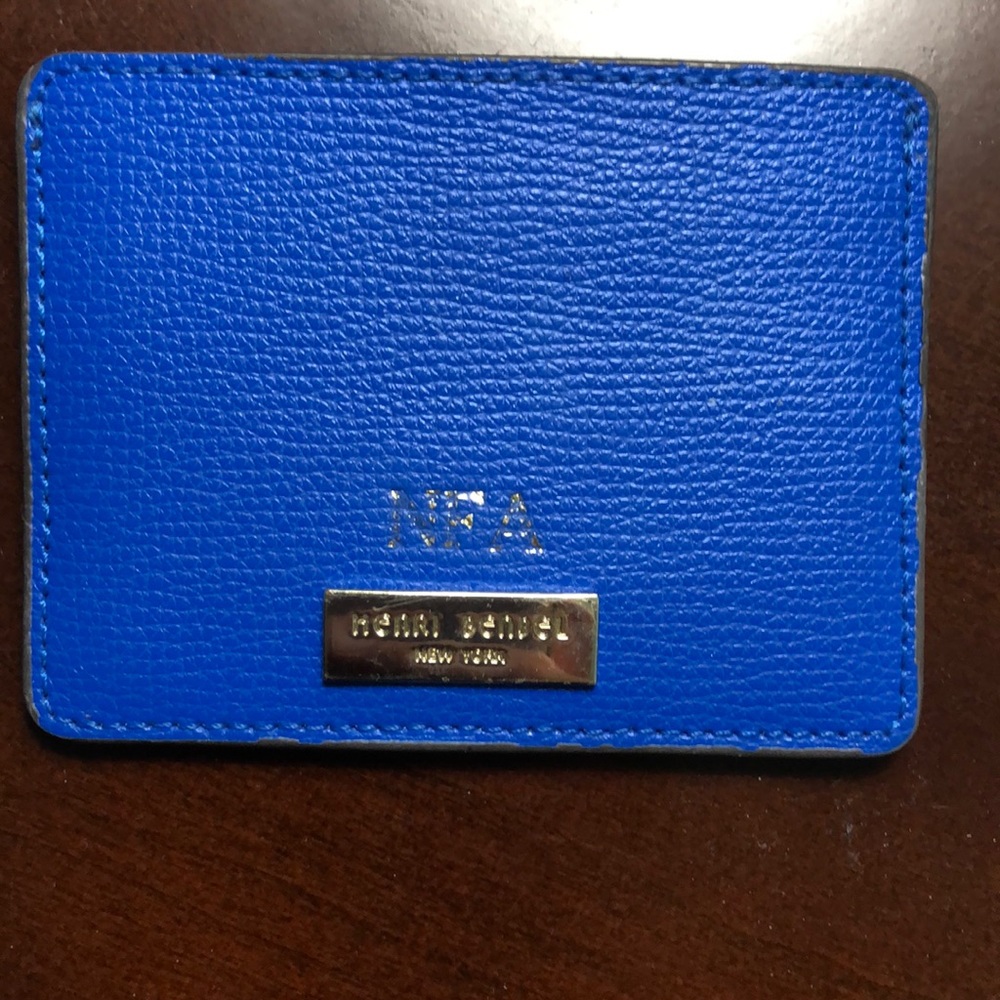 Henri Bendel card case with the initials NFA on it